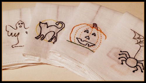 variety of hand embroidered Halloween Tea Towels