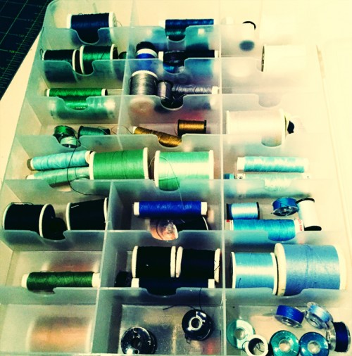 Photo of thread sppols in green and blue hues