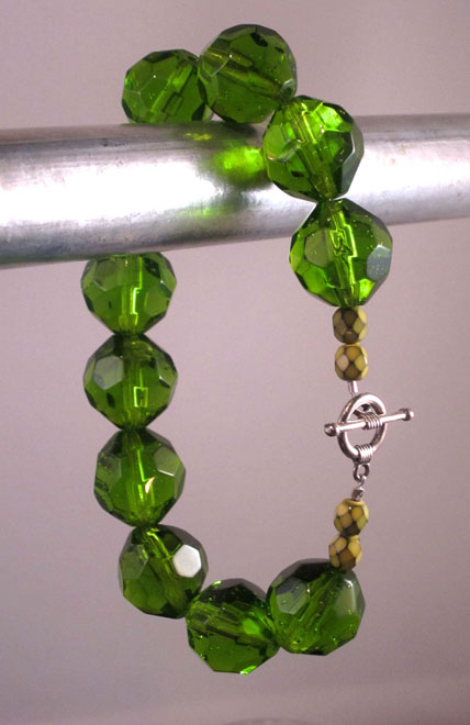 photo of bracelet made by Homegrown Crafts featuring large green acrylic beads and an antiqued silver toggle clasp