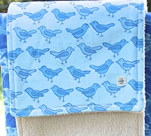 image of burp cloth made by Homegrown Craftswith blue bird print flannel