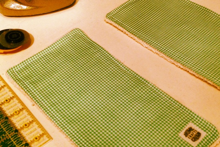 photo of two green and white eco towels made by Homegrown Crafts