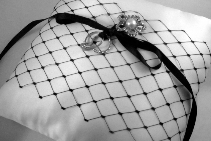 Custom designed ring pillow by Homegrown crafts with rings tied to it