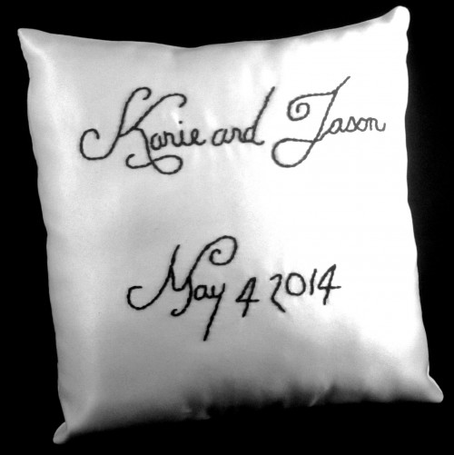 hand embroidered white pillow with black thread