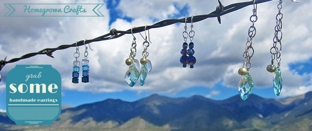 Earrings made by Homegrown Crafts hung on barbed wire